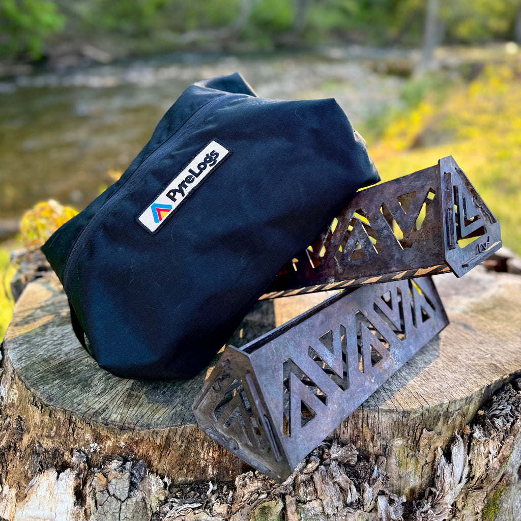 Black bag with PyreLogs logo and metal PyreLogs on a tree stump with a natural background
