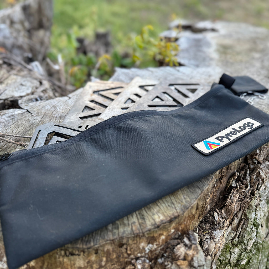 Black pouch with a brand logo on a stone surface outdoors